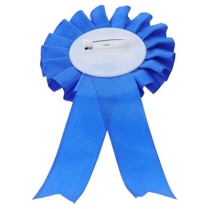 Blue first place rosette seen from the back showing the pin